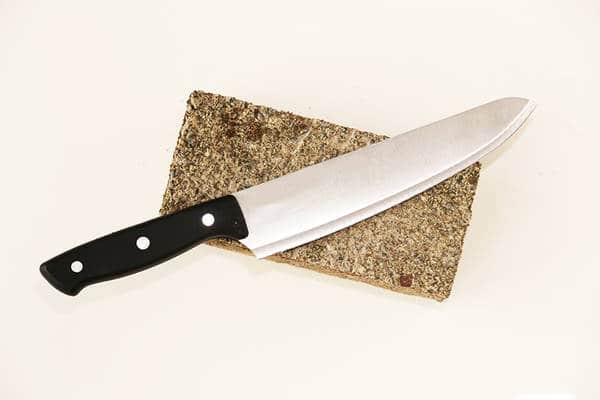 knife blade resting on a stone
